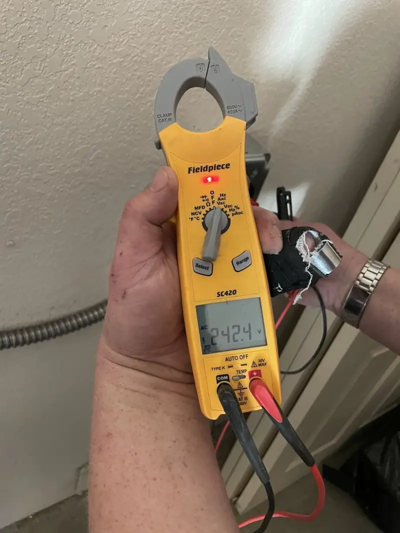 Voltage testing with clamp meter during Electrical Installation Services in Red Oak